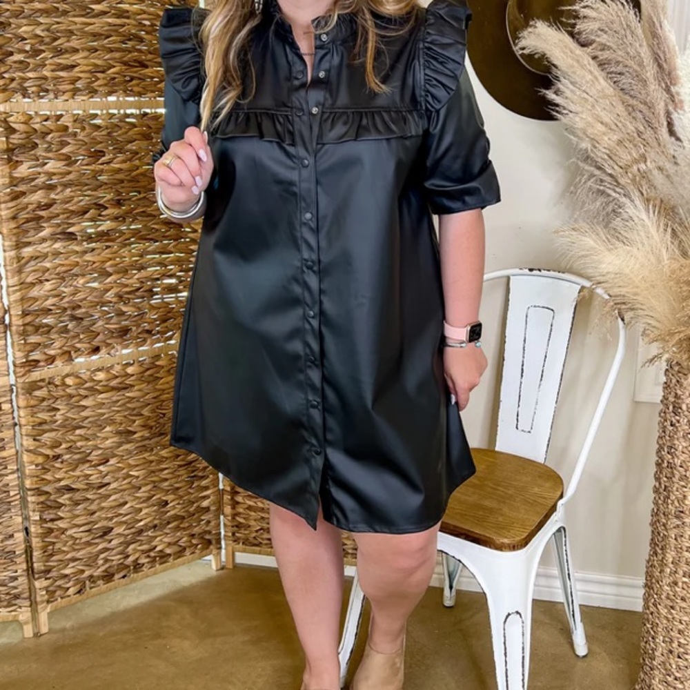 Black faux leather button up dress with ruffle detail